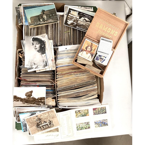67 - A large selection of Edwardian vintage and later postcards, a selection of cigarette and trade cards