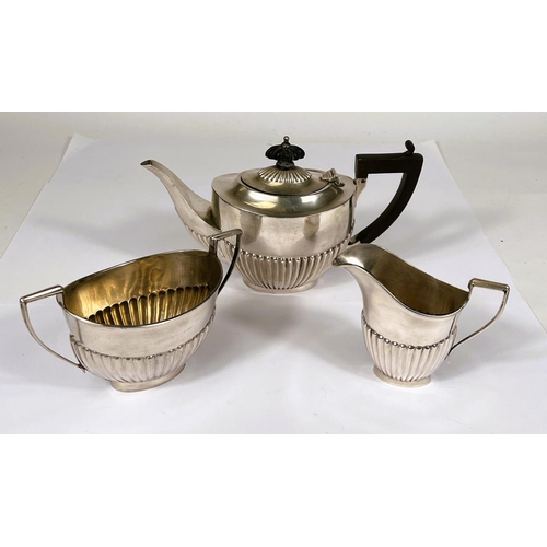 672 - A hallmarked silver bachelors 3 piece tea set in the Georgian oval fluted style