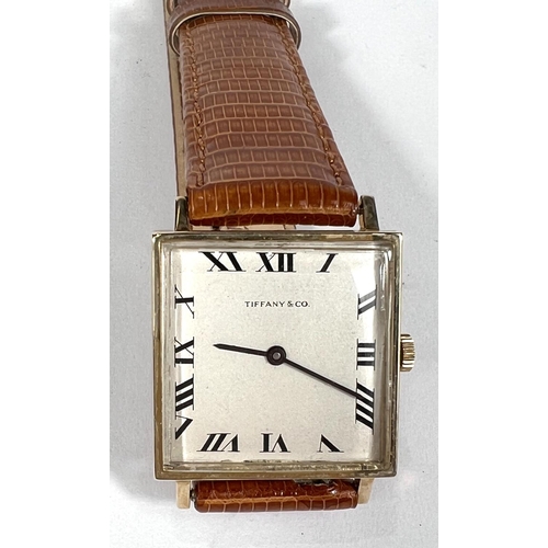 694 - TIFFANY & CO WATCH: a c 1940's 14ct gold cased gent's dress watch marked Tiffany & Co, on me... 