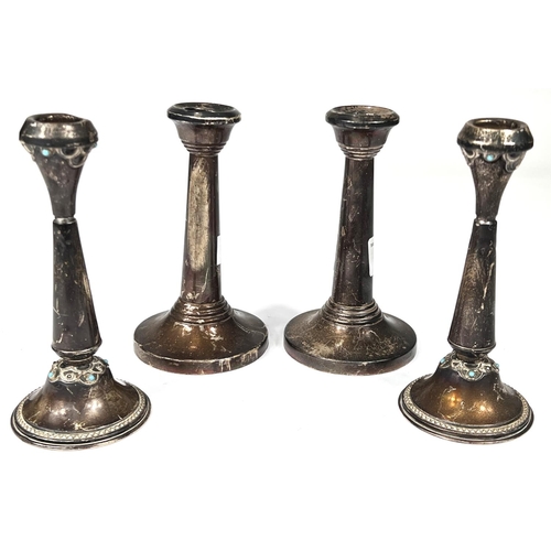 698 - A pair of dwarf hallmarked silver candlesticks on weighted bases, Birmingham 1955 ht. 13cm; a pair o... 