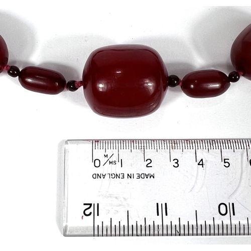 701A - A string of amber Bakelite coloured beads, 80g.