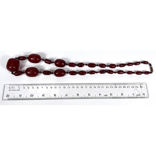 701A - A string of amber Bakelite coloured beads, 80g.