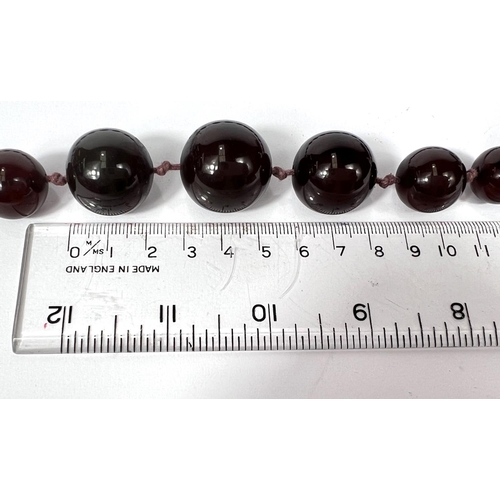 702 - A string of cherry beads, 75g