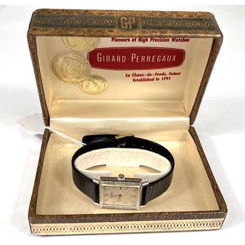 710 - GIRARD PERREGAUX: c. 1970, a white 14ct gold cased rectangular mechanical wrist watch with textured ... 