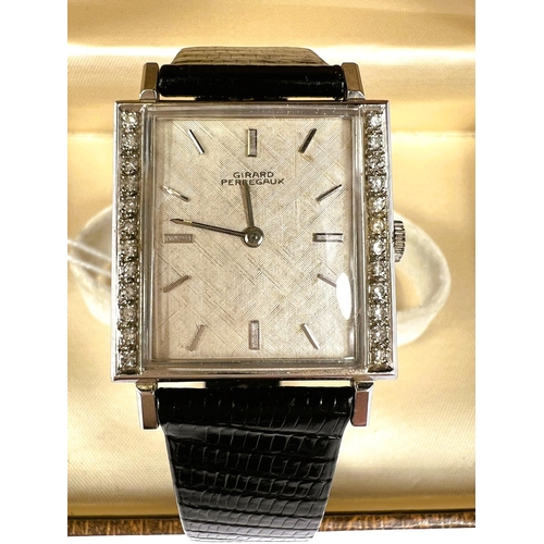 710 - GIRARD PERREGAUX: c. 1970, a white 14ct gold cased rectangular mechanical wrist watch with textured ... 