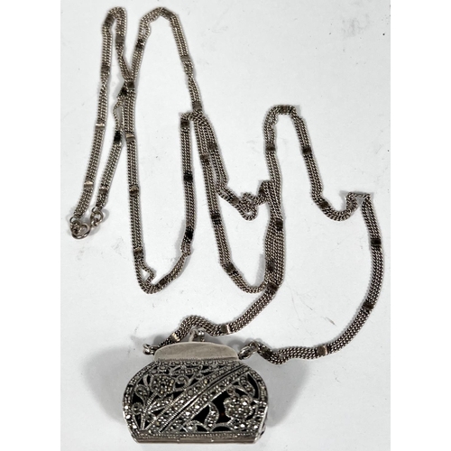 719 - A hallmarked silver novelty marcasite pendant in the form of a purse with triple strand silver chain... 