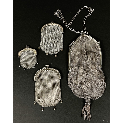 732 - A white metal chain mail bag, stamped 925 with possible import marks; three white metal chain mail p... 