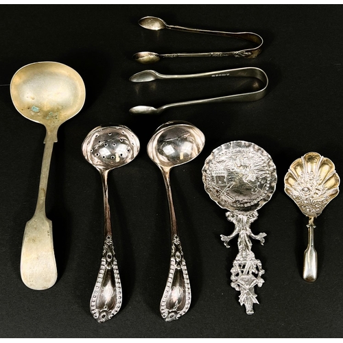 737 - A continental white metal spoon with farm and windmill decoration, silver plated ladles and tongs et... 