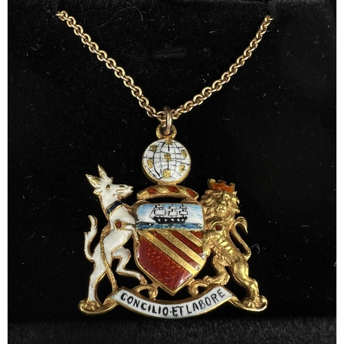 744 - An enamelled 15ct hallmarked gold pendant depicting the Manchester Coat of Arms 8.7gm on fine chain ... 