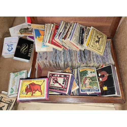 78 - A collection of matchboxes and match box cpvers including Japanese and Chinese examples and a good s... 
