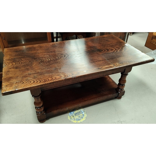 796 - An oak coffee table with turned legs and under ties 