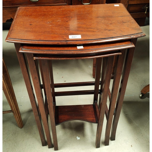 807 - A nest of 3 mahogany occasional tables