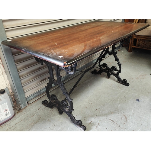 816 - A large 19th century cast metal based pub table with lyre supports