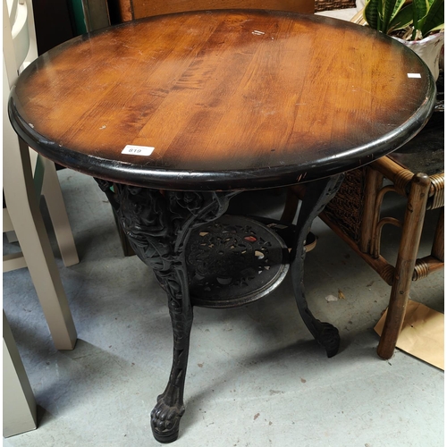 819 - A 19th century cast iron based 'Britannia' circular pub table, with shelf bellow, diameter 69cm