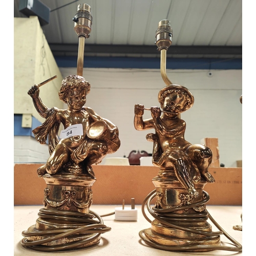 84 - A pair of Classical style plaster cherub musician lamps in gilt.