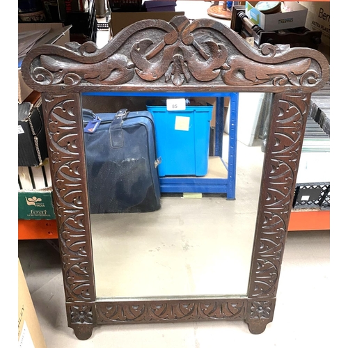 85 - An antique oak framed mirror and a collection of items: Ostrich eg etc. 