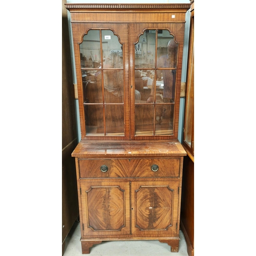 859 - A reproduction mahogany full height bookcase with double glazed cupboard over 2 drawers and double c... 