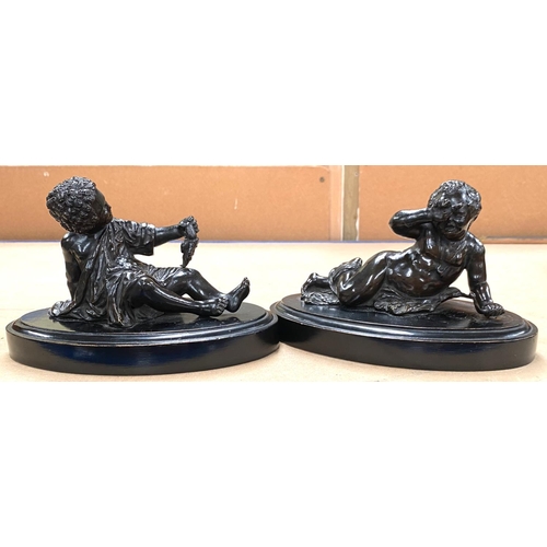 86 - Two bronze figures of children on ebonised plaques.