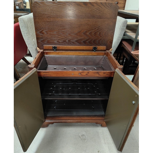 869 - An 18th century style distressed oak hostess trolley in the manner of Titchmarsh & Goodwin enclo... 