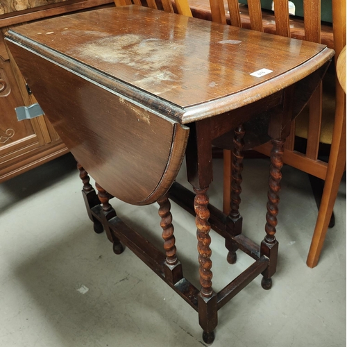 876 - A small oak dining/occasional table with oval drop leaf top, on barley twist legs; an Edwardian maho... 