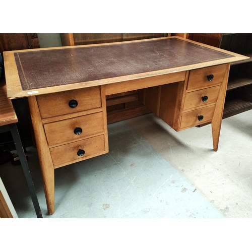 883 - An early to mid 20th century large light oak Cotswold School desk with 6 drawers, 3 to each side wit... 