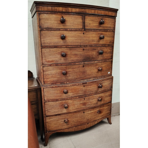 891 - A late Georgian inlaid mahogany bow front chest on chest six long and two short drawers on ogee brac... 