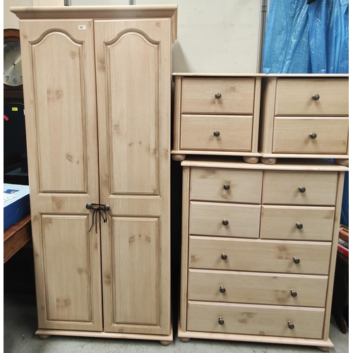 897 - A modern limed oak effect four piece bedroom suite, comp. a double wardrobe, a tall chest of 4 short... 