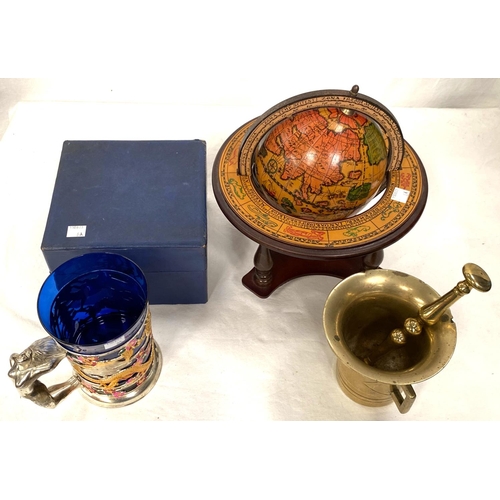 8A - An antique brass pestle and mortar, an Italian globe and a musical tankard, boxed