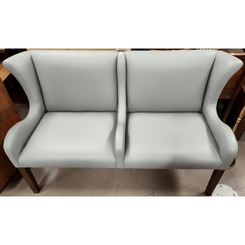 901 - A modern 2 seater settee with wing back, in grey leather