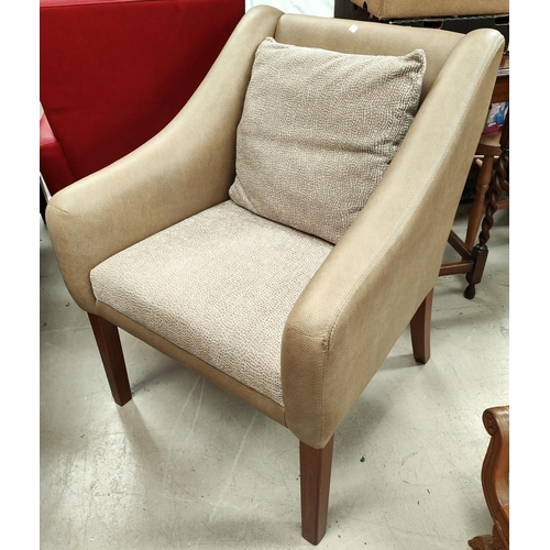 903 - A modern armchair in fawn leather effect