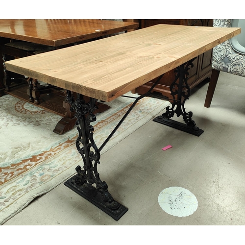 907 - A Victorian style pub table with pine rectangular top, on cast iron base