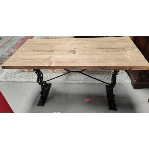 907 - A Victorian style pub table with pine rectangular top, on cast iron base