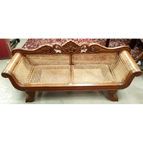 909 - A Victorian style dwarf 2 seater settee in cane with carved crest