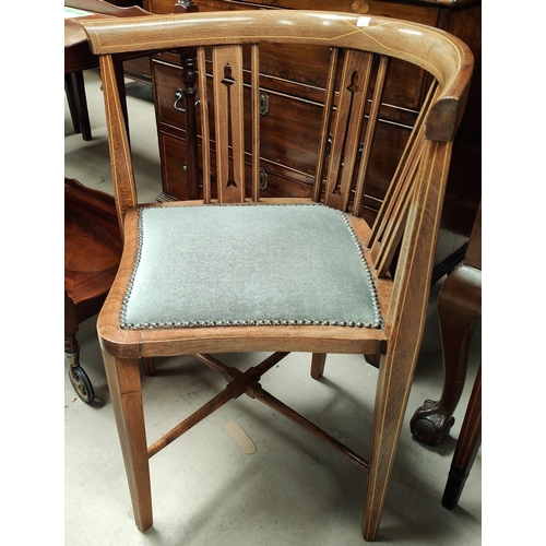 915 - An Edwardian pair of corner armchairs with Sheraton style inlay