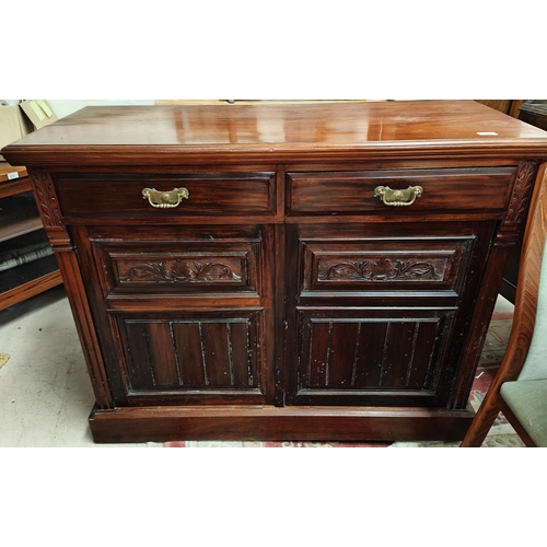 937 - An Edwardian mahogany sideboard with carved and panelled doors and two drawers 96 x 118cm