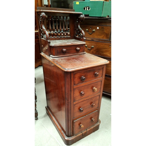 939 - A mahogany pedastal cupboard with four drawers below one above with gallery back