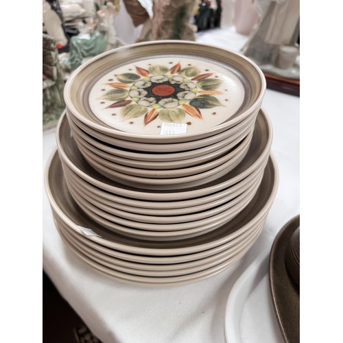 556 - A large selection of Denby dinner and tea ware including plates, soup dishes etc