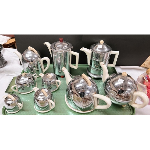 579 - Two Art Deco 3-piece chrome and white pottery Heatmaster style tea sets; 2 similar hot water jugs an... 