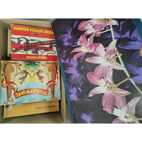 240 - A collection of vintage toys, board games etc