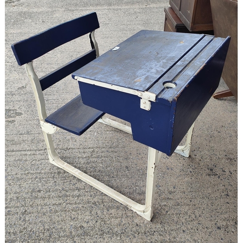 880 - A mid 20th century child's school all in one desk and seat writing slope with hinged storage under w... 