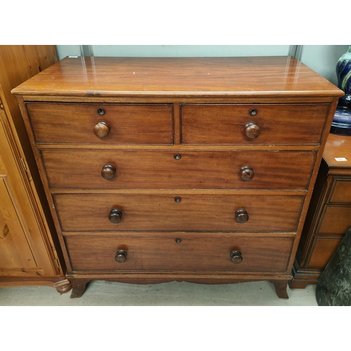 806 - A mahogany chest of three long two short drawers with ogee feet bun handles and wooden escutcheons&n... 