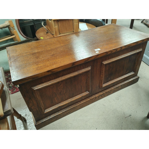 848 - A 1930's oak panelled blanket box