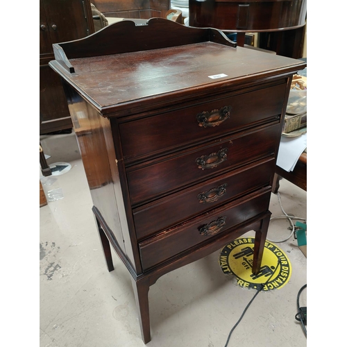 890 - An Edwardian mahogany music cabinet with fall front music drawers