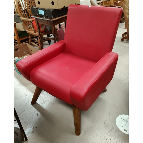 906 - A modern armchair in red leather effect