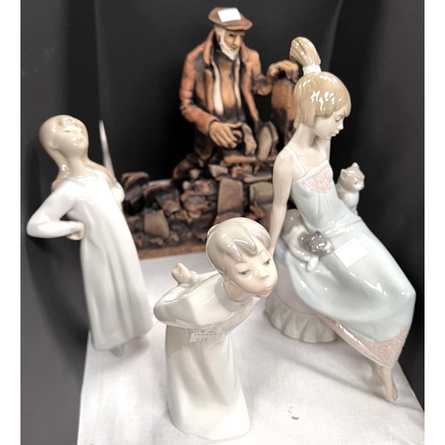 518 - A seated Lladro figure; 2 other Lladro pieces; a studio pottery group:  man drystone walling