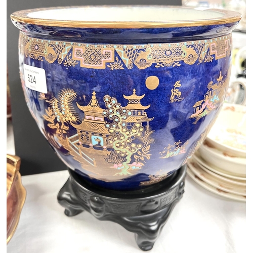 524 - A Carltonware Kang-Hsi jardiniere with blue ground, on black base, height 20cm