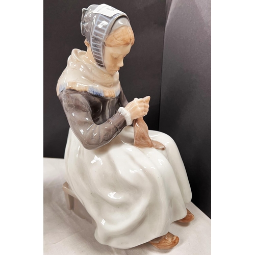 540 - A Royal Copenhagen figure:  Amish girl seated with sewing, height 15cm