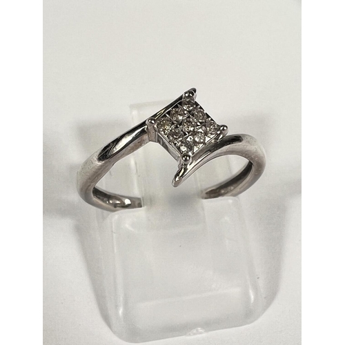 659G - A white gold dress ring with small diamonds in square setting and cross over design,1.9gm, size L