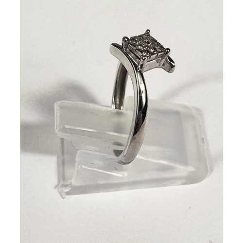 659G - A white gold dress ring with small diamonds in square setting and cross over design,1.9gm, size L