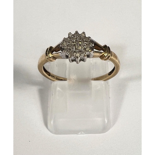 712 - A 9ct gold ring with diamond flower head, 19 stones, 1.8gm